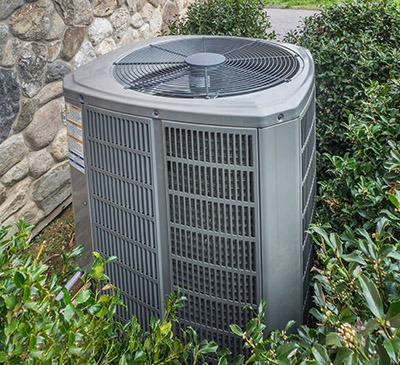 Heating and air conditioning unit in back of a residence